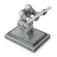 Silver knight desktop pen holder with pen held by armored figurine on base