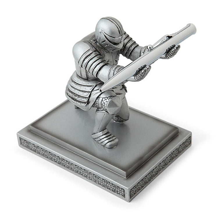 Silver knight desktop pen holder with pen held by armored figurine on base