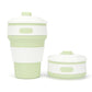 Folding silicone coffee cup with lid, white ribbed sleeve and green base, 350ml travel mug