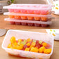 Stacked multi-layer ice trays with cube molds and a box of mixed ice cubes