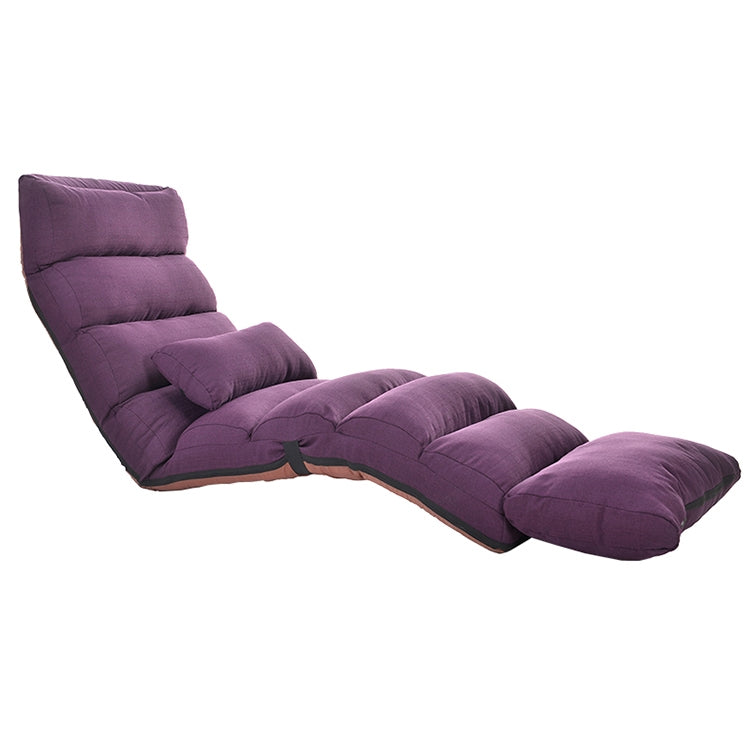 Foldable single recliner floor chair in purple, padded backrest and cushioned footrest