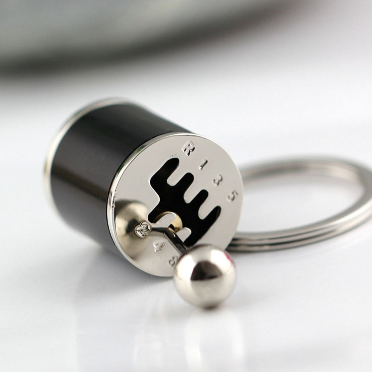Black gear shift keychain key ring with circular plate and hanging metal ball
