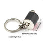 Black gear shift keychain with key ring, metal ball, and measurement details