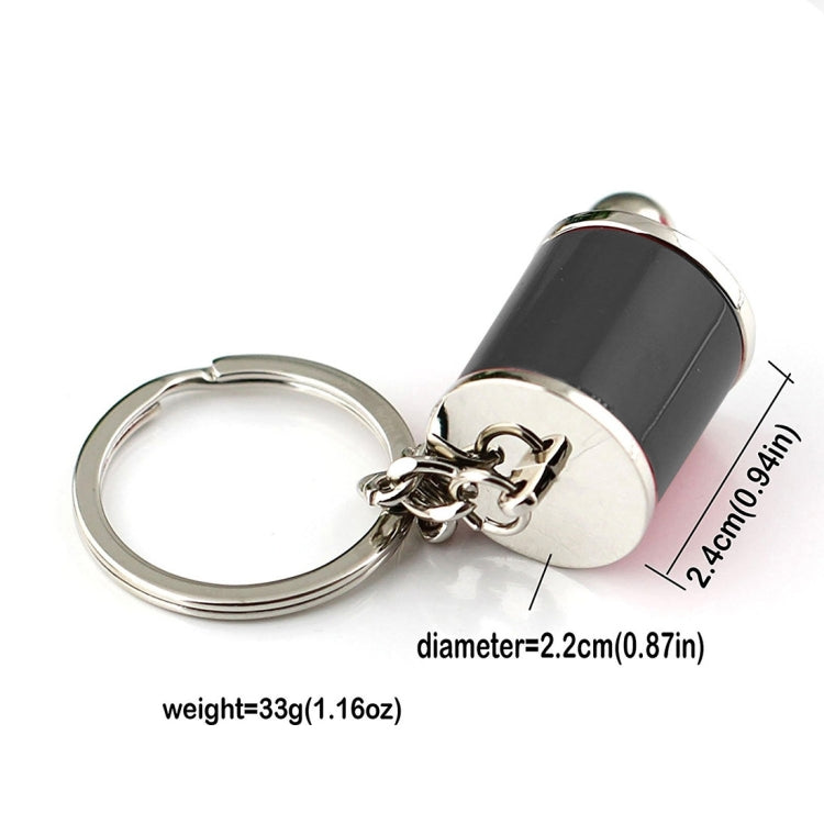 Black gear shift keychain with key ring, metal ball, and measurement details