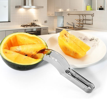 Stainless steel watermelon cutter with curved wheel, slicing a watermelon on a plate
