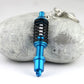 Blue shock absorber keychain with black spring coil and silver key ring