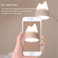 Cat LED night lamp glowing beside a smartphone showing the lit lamp