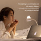 Cat LED desk night lamp glowing next to a laptop in a bedside setup