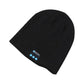 Black knitted beanie with small Bluetooth control panel patch on the front.