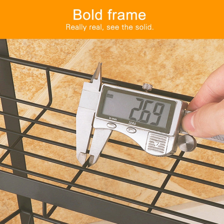 Black spice rack with grid front and digital caliper measuring spacing