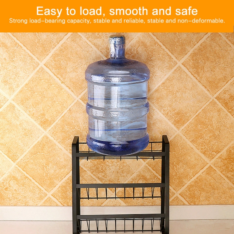 Three-tier black metal spice rack supporting a large water dispenser bottle