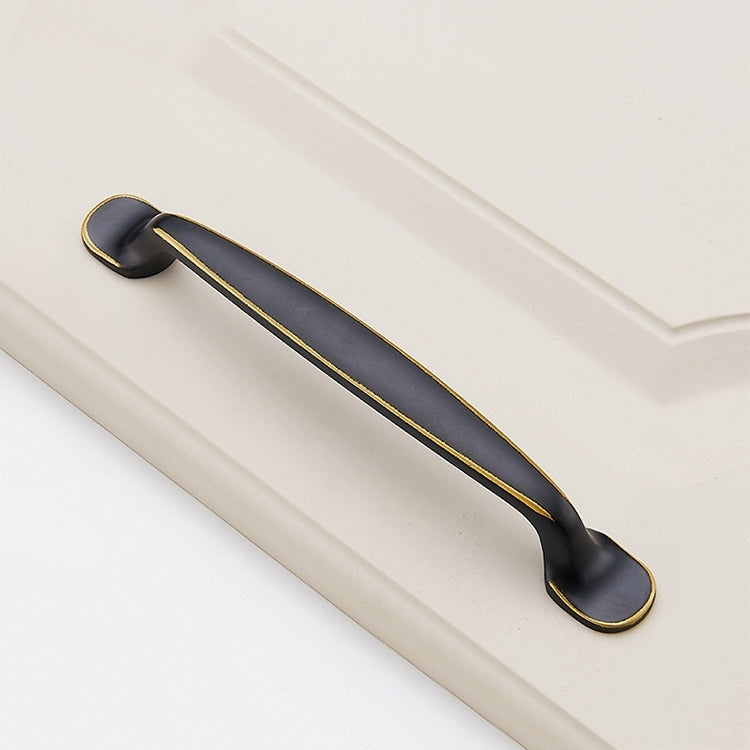 Black brass drawer cabinet handle with curved bar and gold edge trim