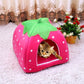 Pink strawberry-pattern pet tent with green leaf top; cat inside front opening