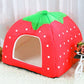 Red fabric pet play tent with green leaf top and white polka-dot arch opening