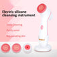 Pink electric silicone facial cleansing instrument with round vibration heads and base