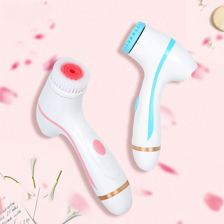 Pink handheld facial cleansing brush with silicone vibration head and second interchangeable head