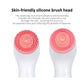 Two red silicone brush heads with swirl texture for facial cleansing