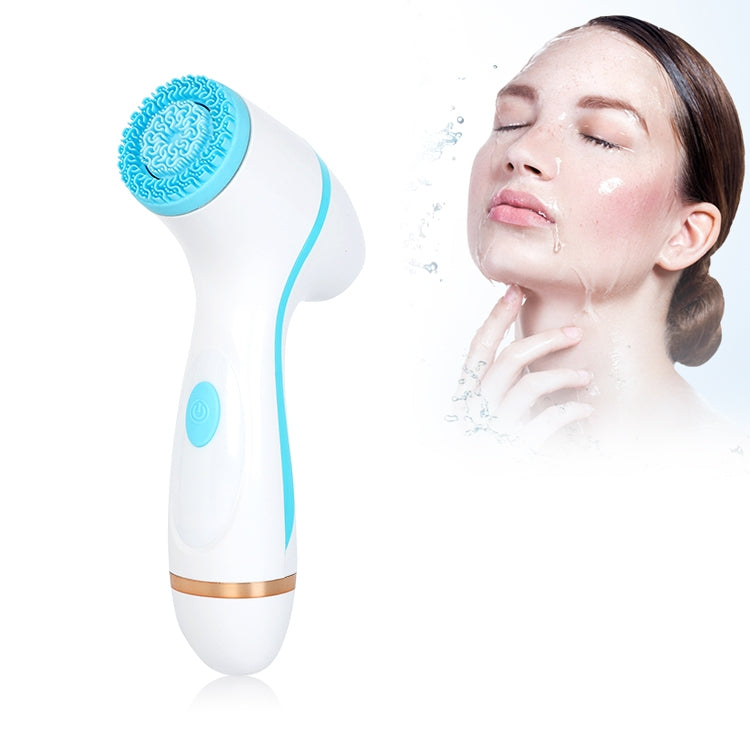 Blue facial cleansing brush against a woman’s face with round silicone vibration head