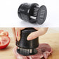 Meat tenderizer press with black body and stainless pin base, held over steak