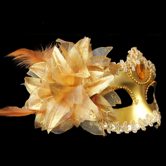 Gold masquerade mask with crystal trim, amber teardrop center jewels, and oversized yellow flower