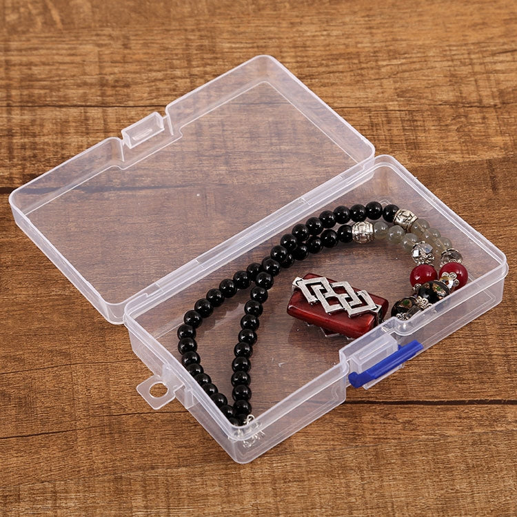 Clear plastic storage box with blue latch, holding beaded jewelry and bracelet