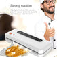 White vacuum food sealer next to a person and vacuum-sealed snack bag