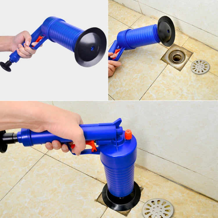 Blue pneumatic drain blaster clearing a floor drain with black base and nozzle