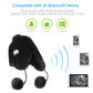 Black plush ear-muff hat with dangling pom-poms and small control panel for Bluetooth