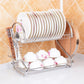Chrome dish drying rack with stacked plates and cups, angled front