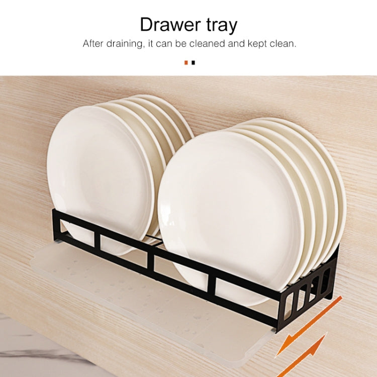 Wall-mounted drawer-style rack with black frame holding white plates