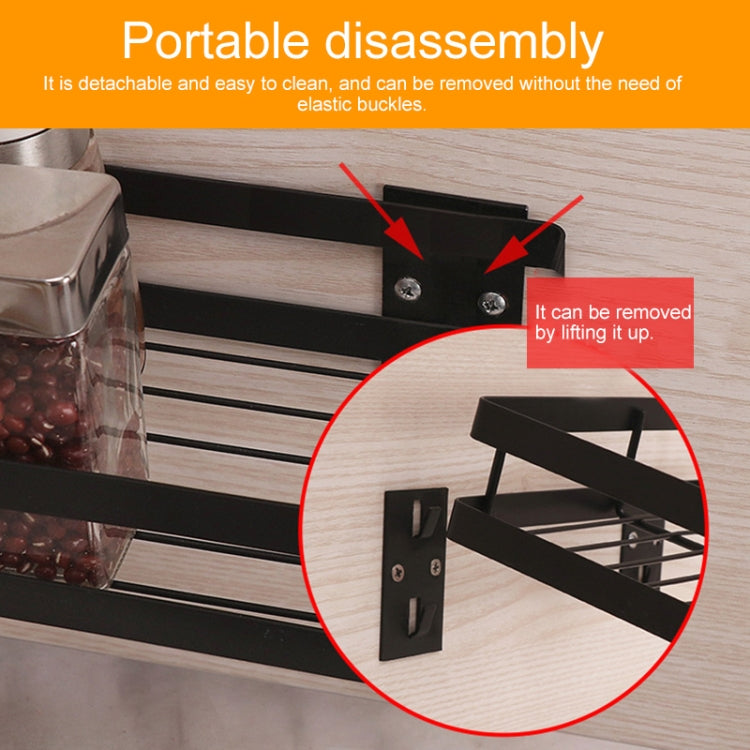 Black rack close-up showing removable wall bracket with screws and base bars