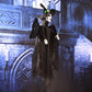Hanging ghost decoration in black, profile view with wide hat and flowing robe
