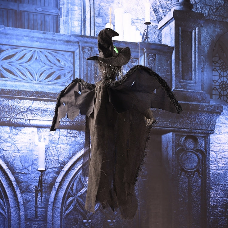Hanging ghost decoration in black with wide hat, pale face, and loose hanging sleeves