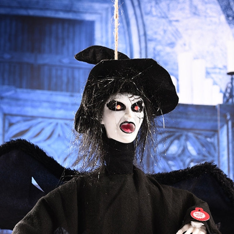 Close-up of a black hanging ghost face with white skull makeup, red eyes, and hat
