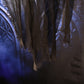 Close-up of draped black ghost robe fabric with hanging fringes