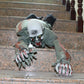 Creeping zombie ghost costume with snarling skull mask, yellow eyes, gray sleeves and hands