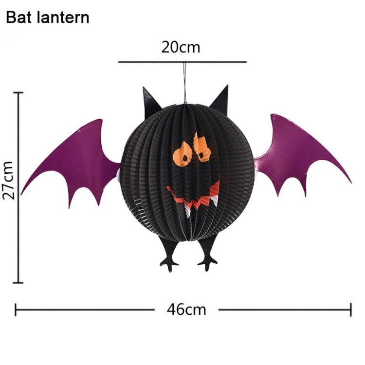 Black bat paper lantern with purple wings and orange spooky face, hanging decoration