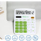 Desktop calculator on white surface with large LCD and green keypad buttons