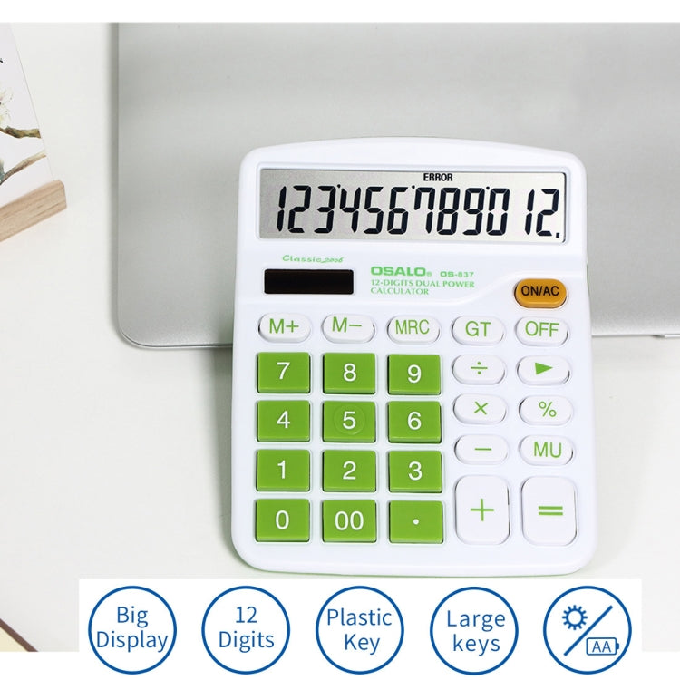 Desktop calculator on white surface with large LCD and green keypad buttons
