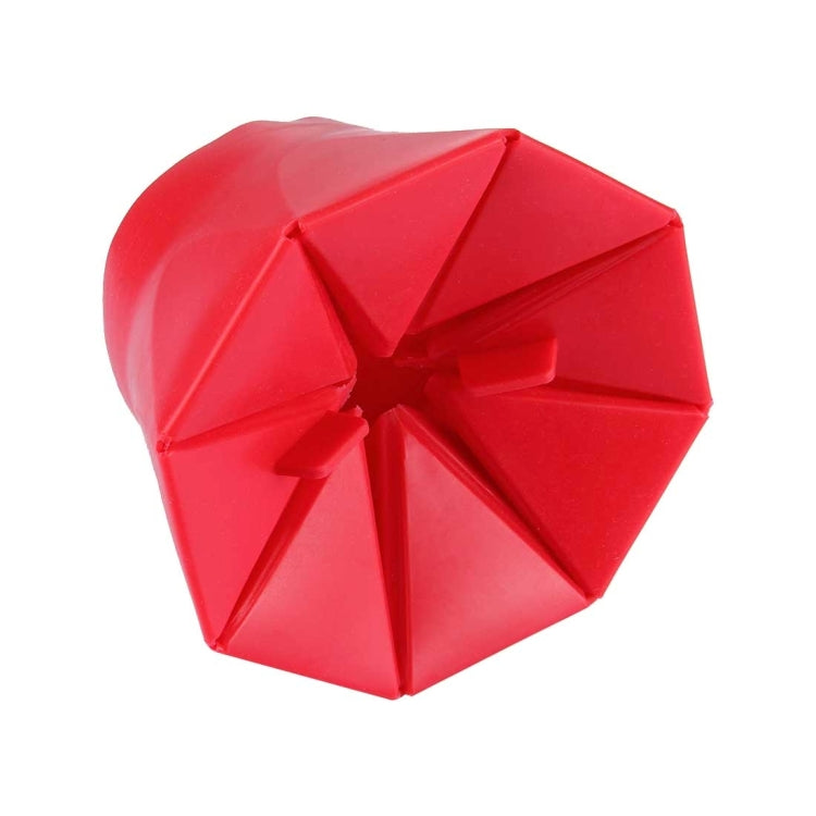 Red foldable silicone popcorn maker folded into a compact hexagon