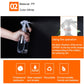 White plastic trigger spray bottle with safety latch and lock arrow