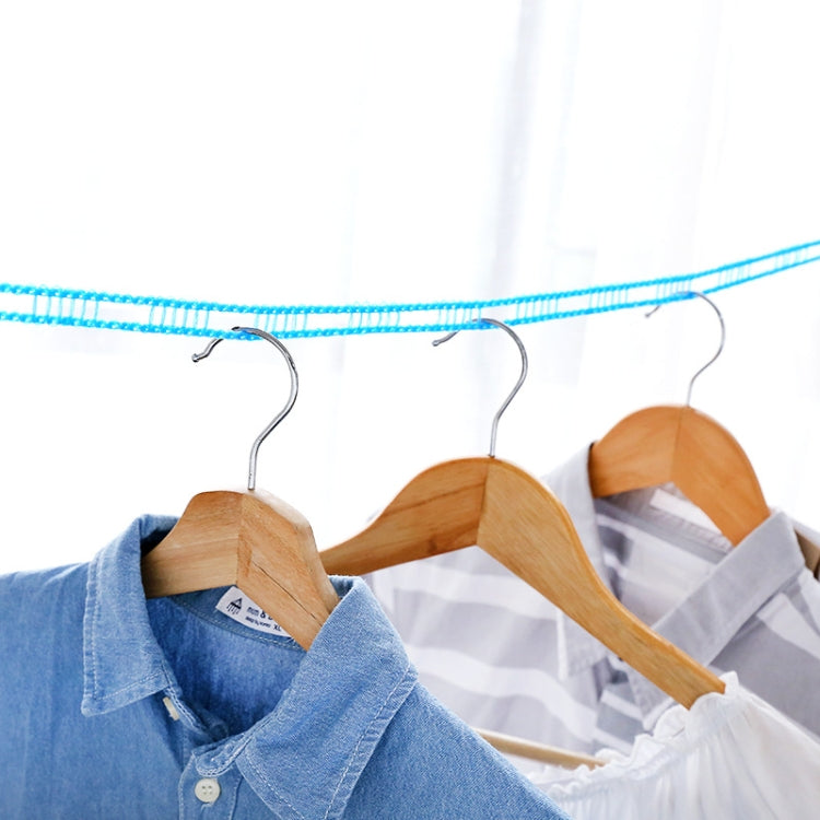 Windproof clothesline rope with metal hooks, holding shirts on wooden hangers