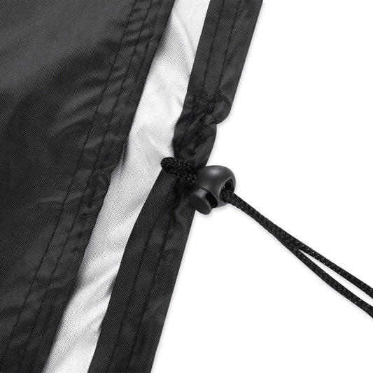 Drawstring cord with black toggle on BBQ grill cover edge