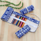 Blue elephant print pencil wrap case with 48 slots holding multicolor pens
