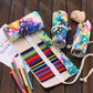 Open starry sky pencil roll-up case with multicolor pens in 48 elastic compartments