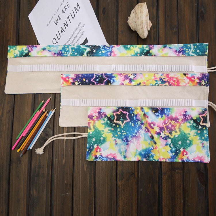 Flat roll-up pencil case with starry galaxy fabric, elastic holders and drawstring flap