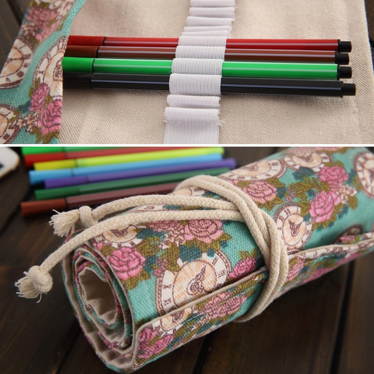 Close-up of canvas pencil roll: colorful pens, white elastic bands, rose-clock print lining