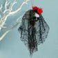 Black tulle hanging skull ornament with red flower headpiece