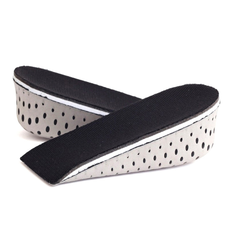 Black-and-white heel insert pad with curved arch support and dotted underside