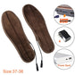 Dark brown heated insoles with USB cords and power adapter shown